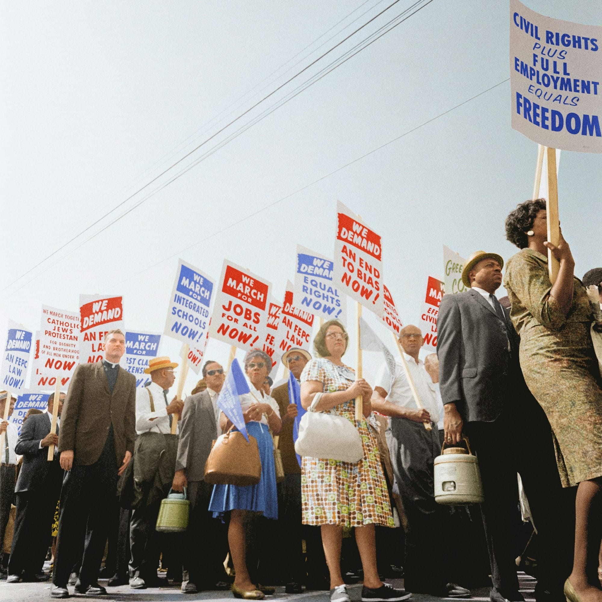 Demonstrators holding signs demanding the right to vote and equal civil rights at the March on Washington