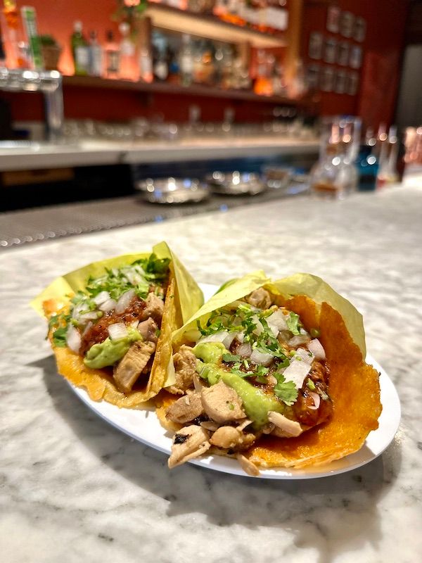 Pollo adobado tacos with chicharrón de queso (crispy cheese) at Copas
