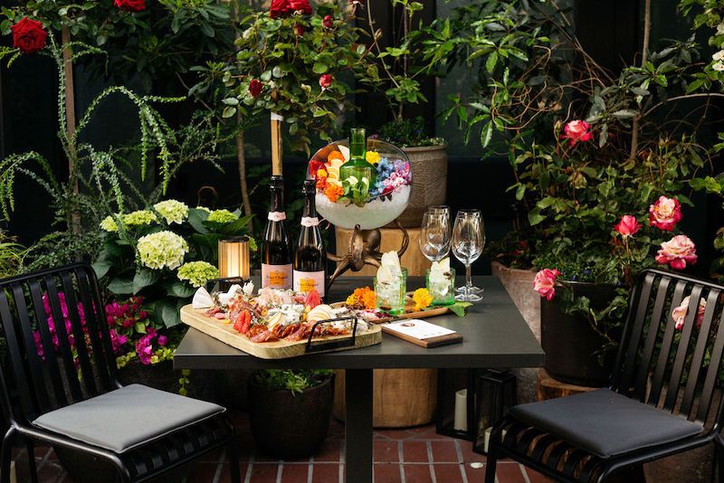 patio at La Bande with bubbles and salumi