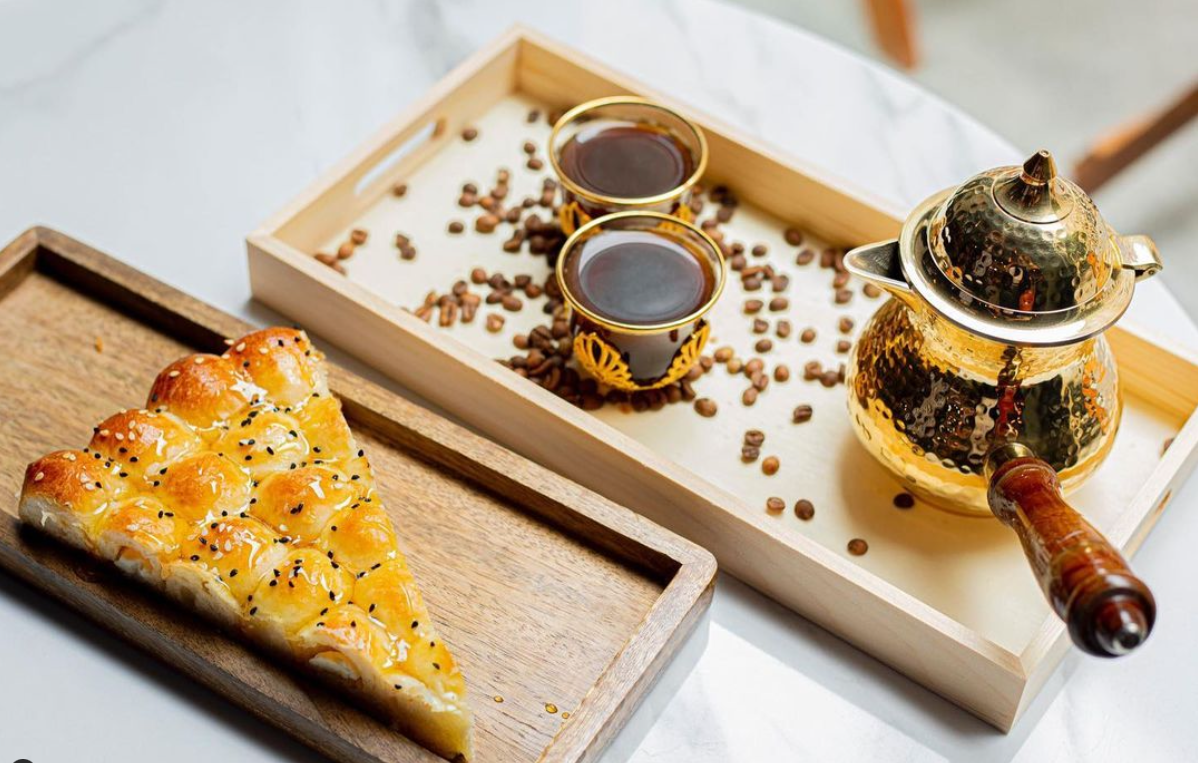 Cheese bread drizzled with honey with Yemeni coffee at Sana’a Cafe