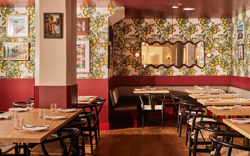 The sunny, Italian coastal style of Corzetti's dining room