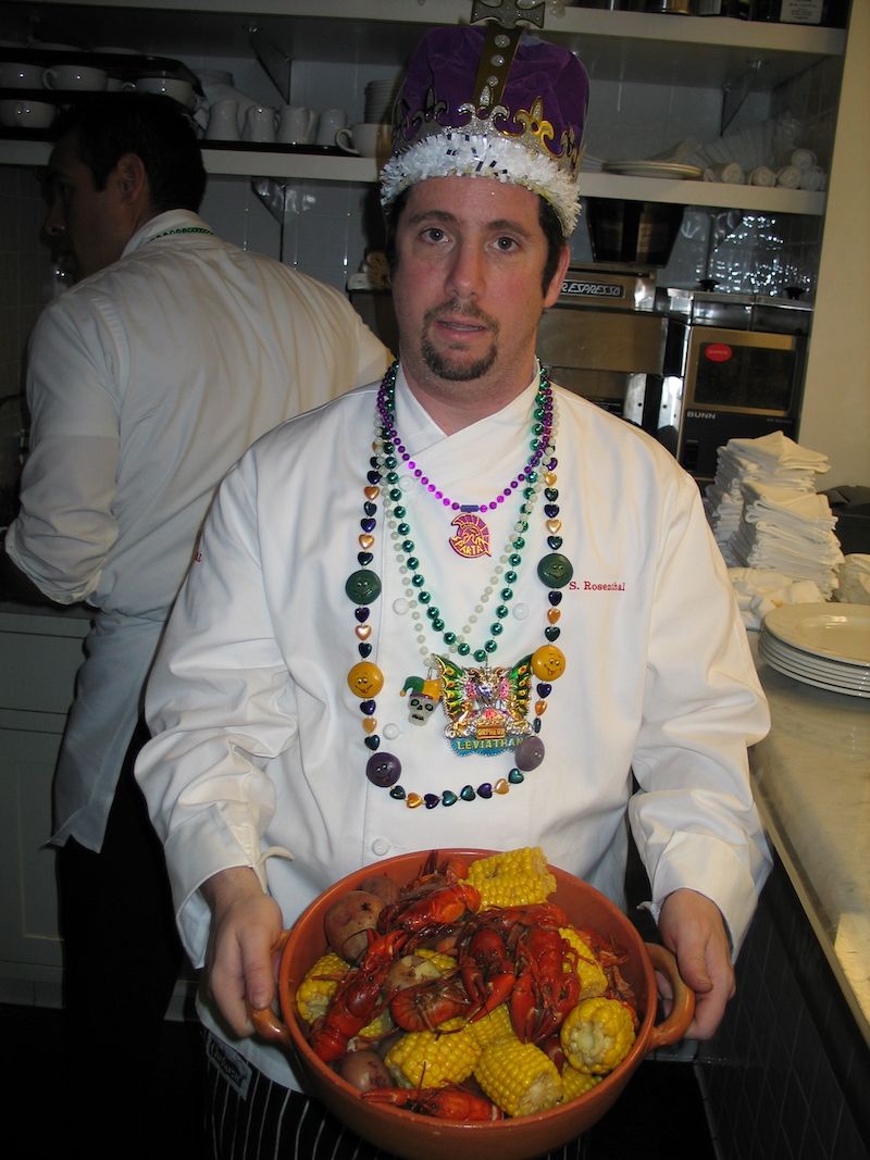 Steven Rosenthal holding a bowl of crawfish boil at Town Hall’s Mardi Gras party.