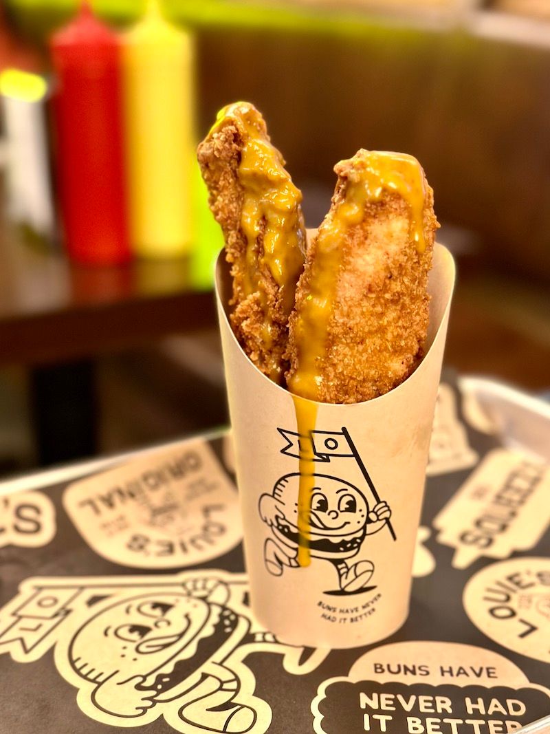 Cornflake-coated chicken tenders with dripping honey mustard sauce