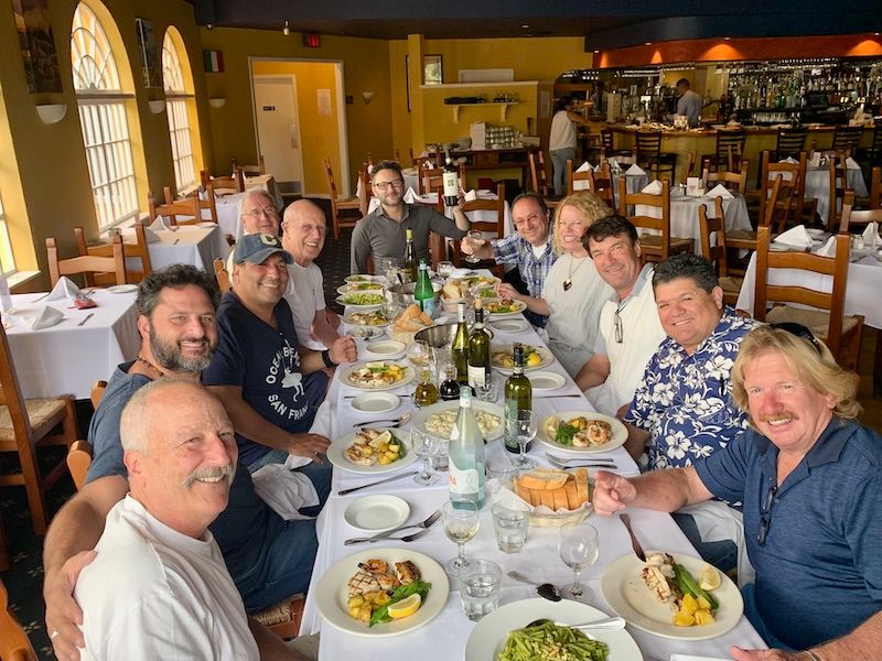 my Dad and his buddies sitting at a long table for their Friday lunch club at Mezza Luna