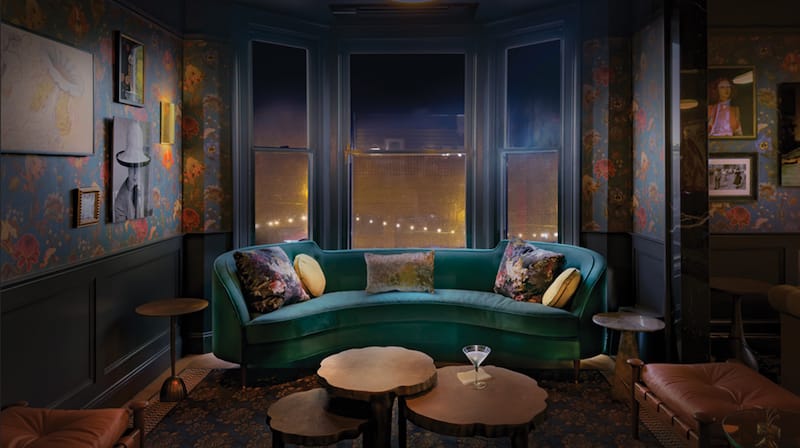 teal curving divan in one of the seating areas