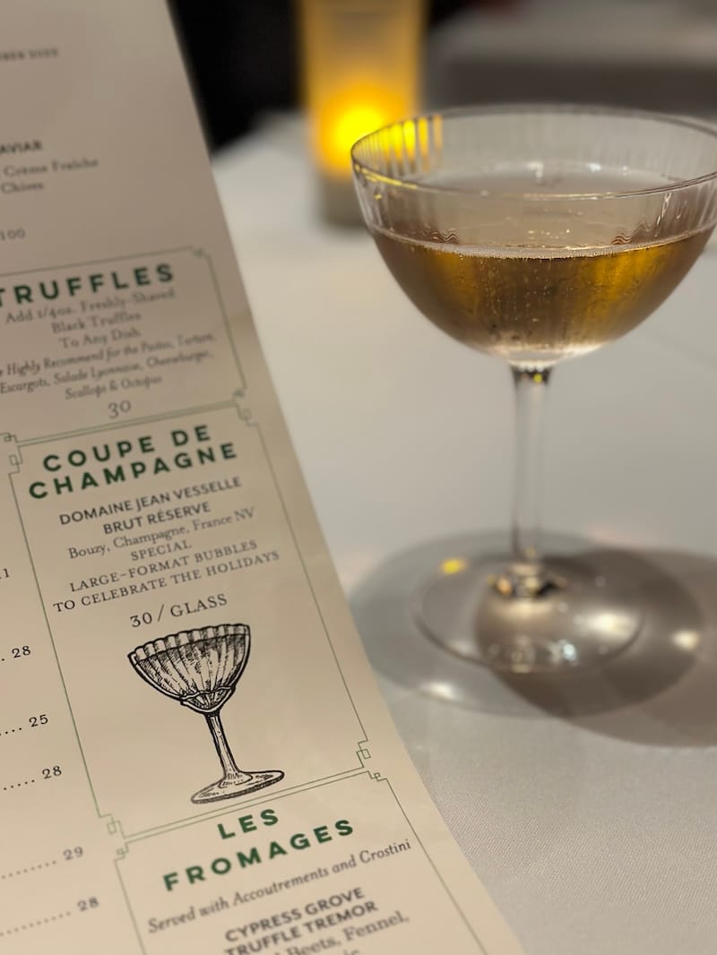 a coupe of champagne at absinthe