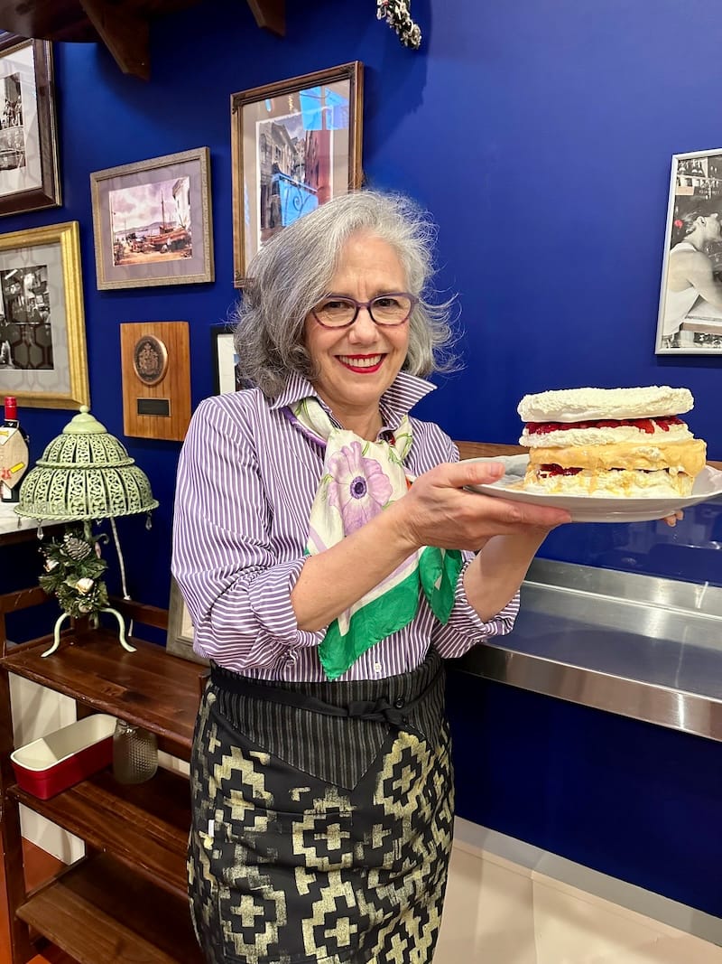 Chile Lindo founder (AKA The Girl from Empanada), Paula Tejeda, and her torta de merengue. Photo: © tablehopper.com.