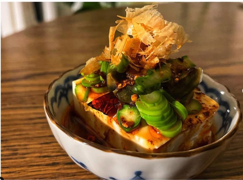 Tofu with asparagus, century egg, mouthwatering sauce from Four Kings. Instagram photo via @fourkings_.