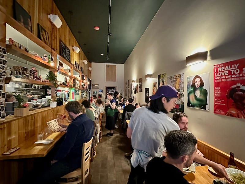 Chef Mike Long serving guests in the narrow dining room. Photo: © tablehopper.com.