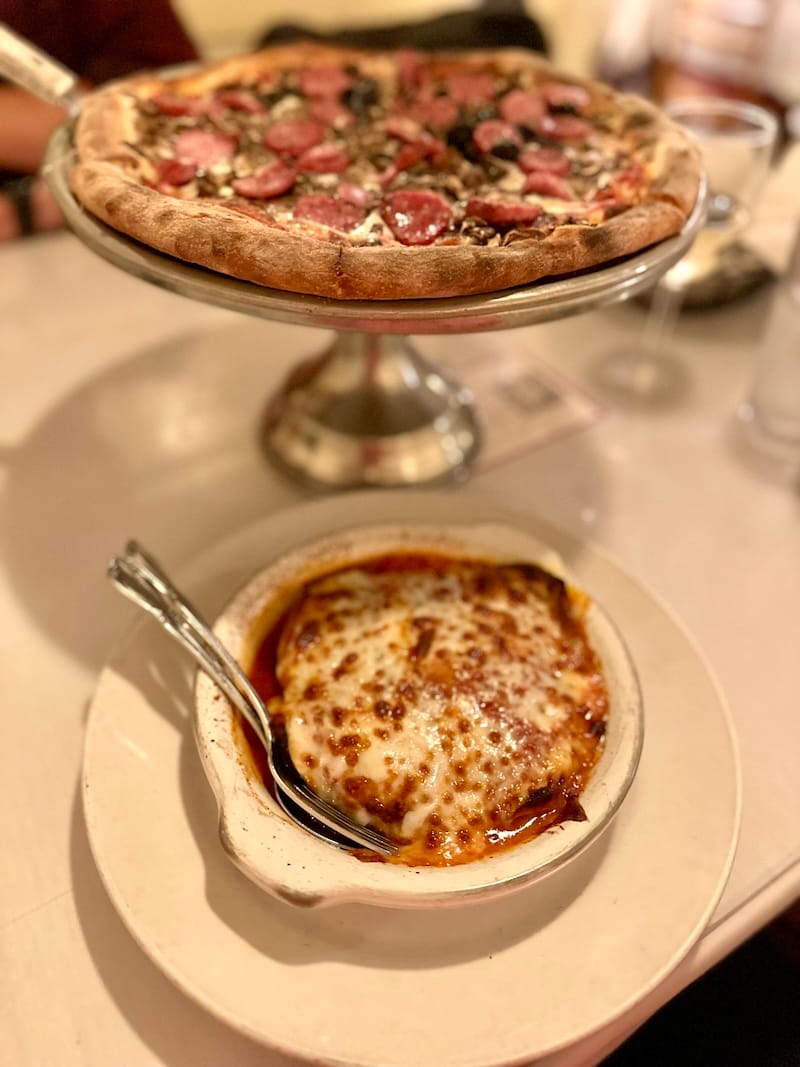 Tommaso’s pizza and eggplant Parmigiana. Photo: © tablehopper.com.