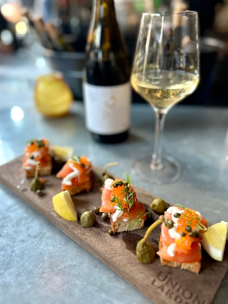 How to beat the heat: house-cured lox with smoked trout roe and horseradish crème fraîche with a glass of Peter Lauer Saar riesling sekt brut at the bar at Union Larder. Photo: © tablehopper.com.