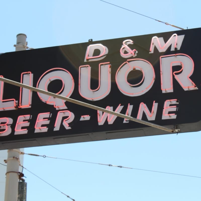 D&M’s trademark neon sign on Fillmore. Photo via D&M Wine and Liquor’s Facebook page.