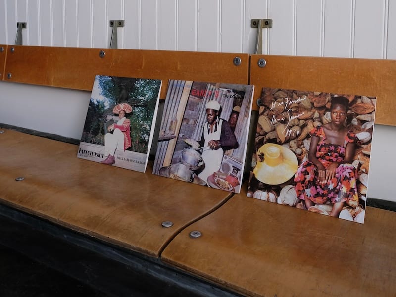A selection of records from Side A’s collection on Universal Cafe’s wood banquette. Photo courtesy of Side A.&nbsp;