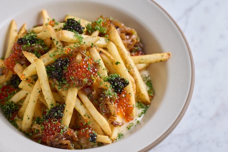 At Sunday’s open house, I got a taste of Side A’s “cheese fries” with Mornay sauce, caramelized onions, and Tsar Nicoulai smoked trout roe and caviar. Photo: Molly DeCoudreaux.