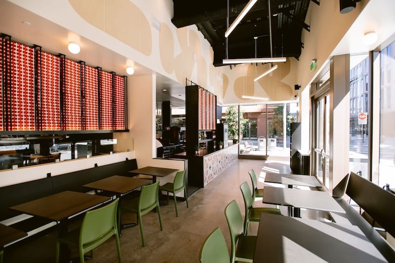 You can sit down to enjoy your pizza onsite with a Flour + Water spritz. Photo: Kristen Loken.