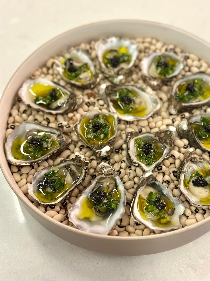 A stunning first taste at Saturday’s Hands Please dinner event at Four One Nine: oysters with salted collard greens, smoked ham fat, and holy trinity (by chef Byron Hughes of Last Supper Society). Photo: © tablehopper.com.