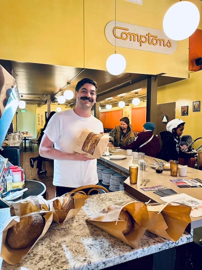 Leaven Worth’s Matthew Reyes selling loaves at the Compton’s Cafeteria Riot set on First Thursday Art Walk.&nbsp;Photo: © tablehopper.com.