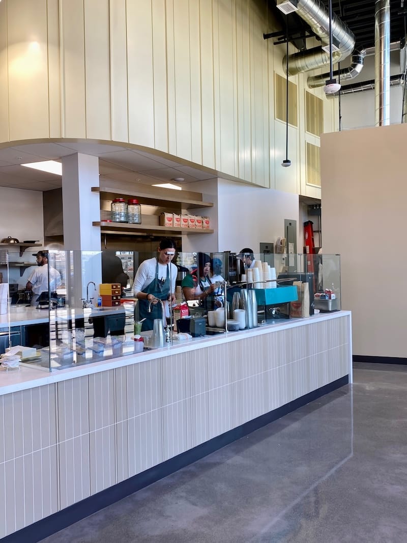 Baristas making signature drinks, like the black sesame cappuccino and a sparkling yuzu Americano. Photo by Olivia Casellini for © tablehopper.