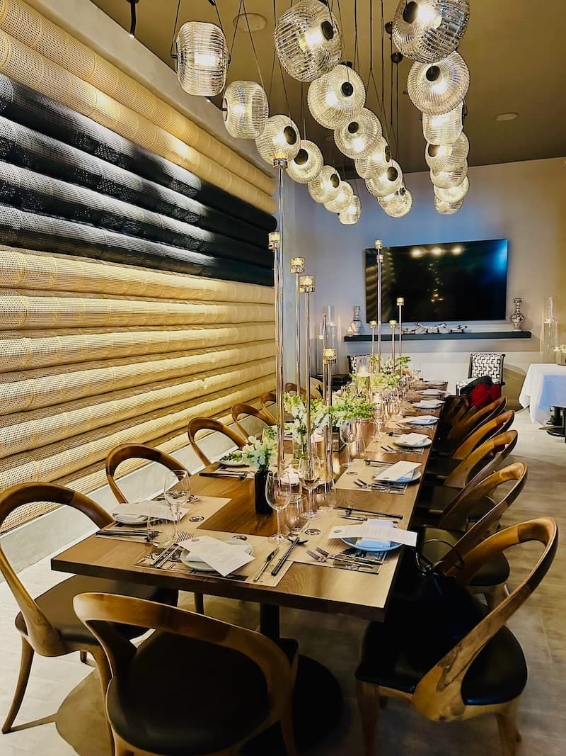 The group dining table made from reclaimed wood. Photo: © tablehopper.com.