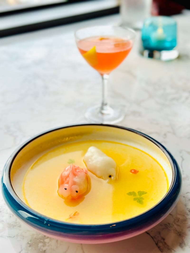 Whimsical dumplings made to look like koi and squid 🦑 in a magical hot and sour soup at Empress by Boon. Photo: © tablehopper.com.