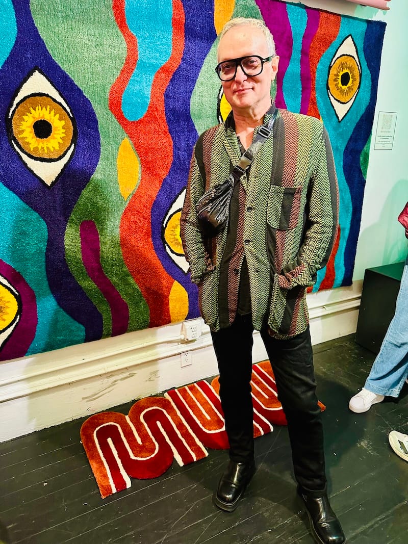 My Art Walk wingman in front of Cabure Bonugli’s handmade fiber art at Rosebud Gallery. Photo: © tablehopper.com.