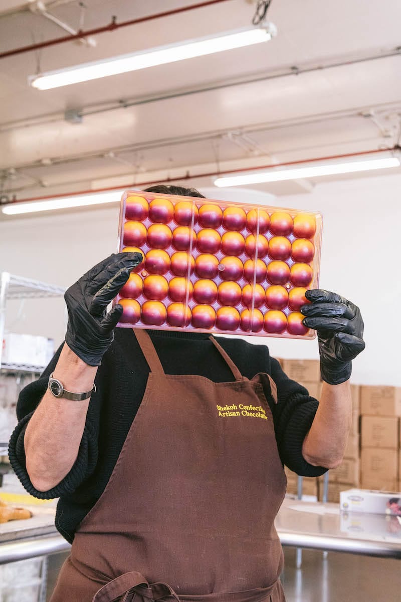 Step one of the process: a hand-painted mold that will become a honey lavender bonbon. Photo: ⓒ Brianna Danner.