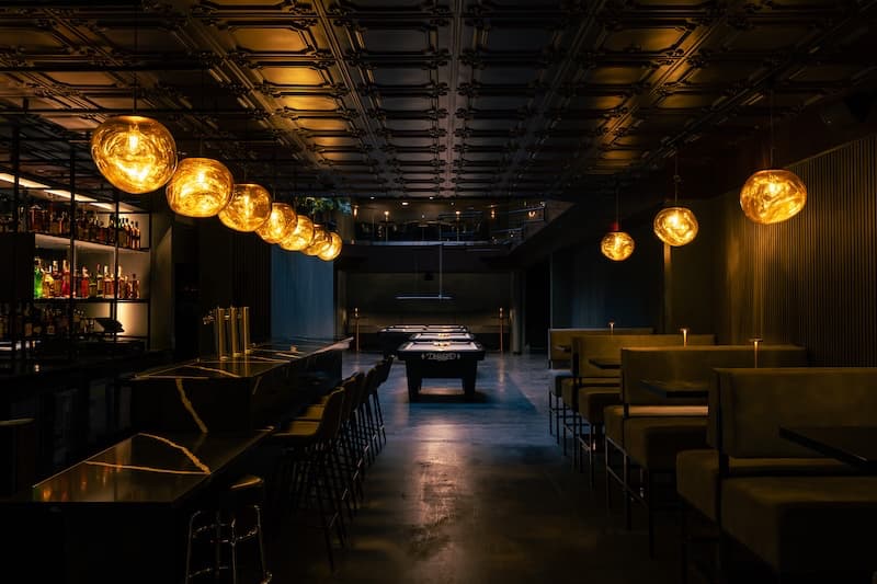 It’s time to play pool and have a signature cocktail at the bar. Photo courtesy of The Hall.