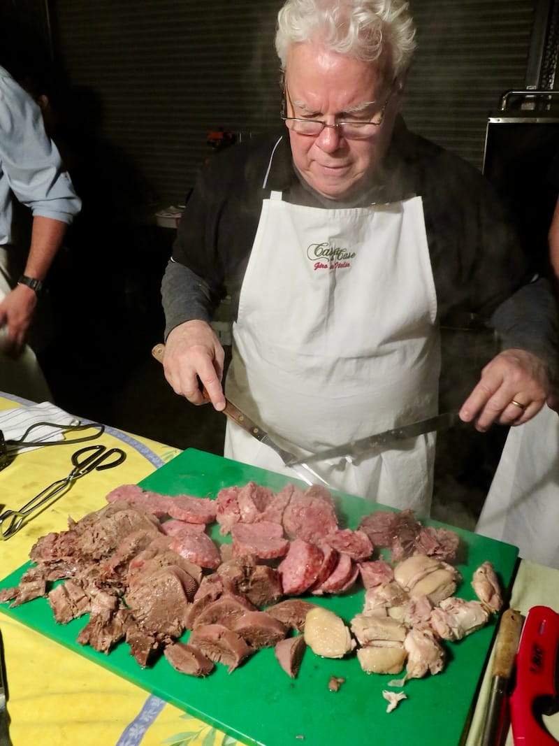 Howard Case slicing up meats for the bollito misto Cena nel Magazzino in 2014. Photo: © tablehopper.com.