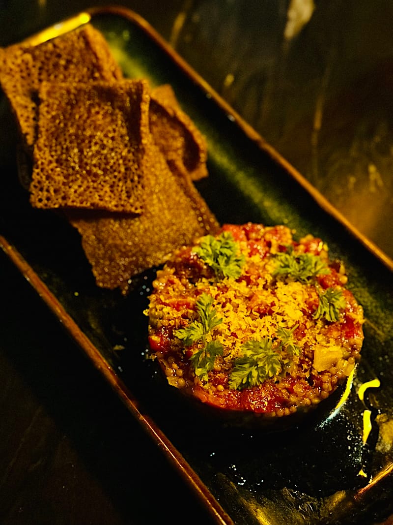 Late-night kitfo tartare at Meski: beef tenderloin, nitir kibbeh oil, cured egg yolk, chervil (love!), and the brilliant injera chips. Photo: © tablehopper.com.