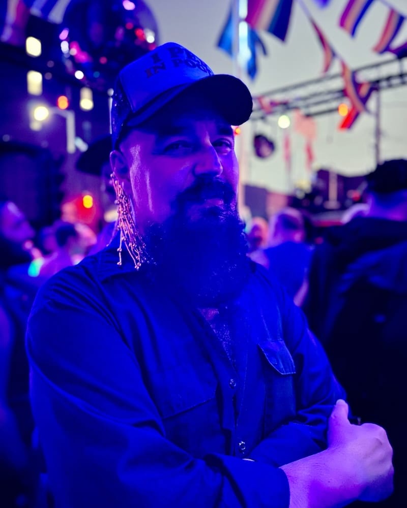 Bus Station John taking a quick break from the DJ booth on the patio of the SF Eagle during Disco Daddy (Pride 2023). Photo: © tablehopper.com.