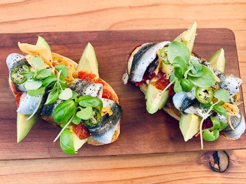 Anchovy toastin’ at The Anchovy Bar. Photo: © tablehopper.com.