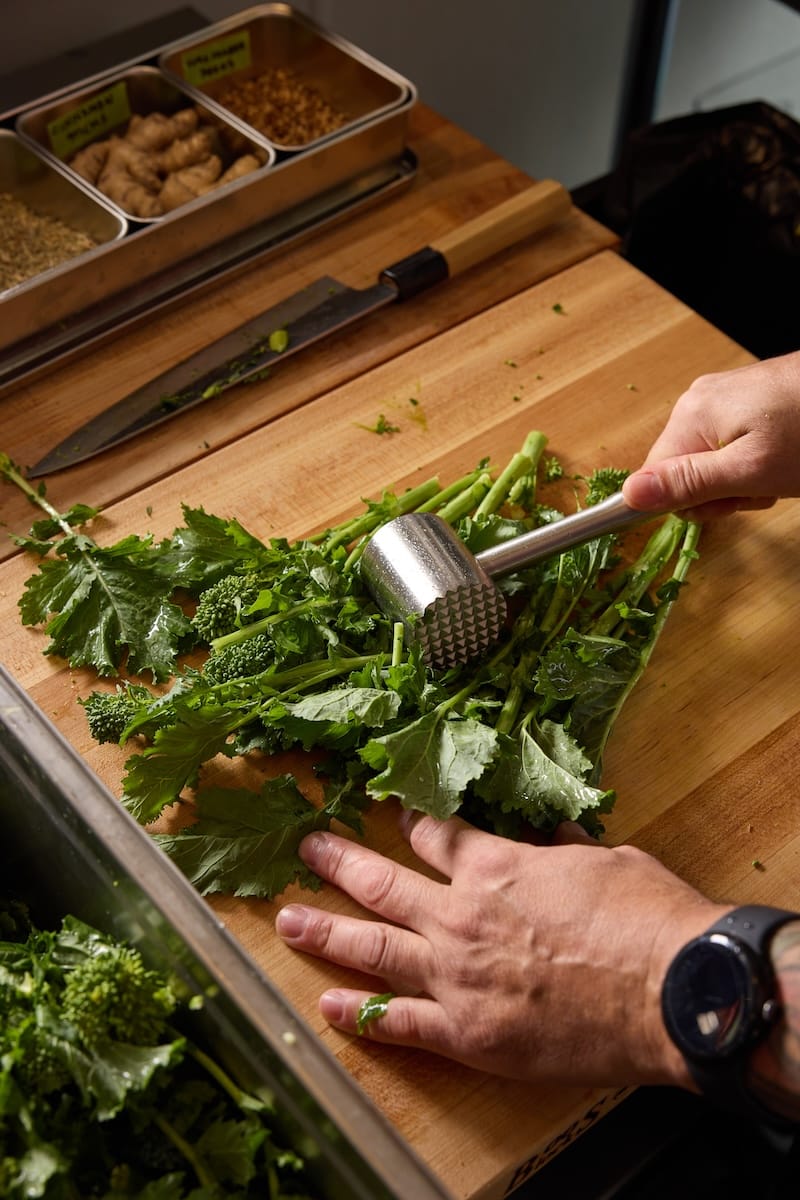 Tenderizing the broccoli rabe. Photo: Molly DeCoudreaux.