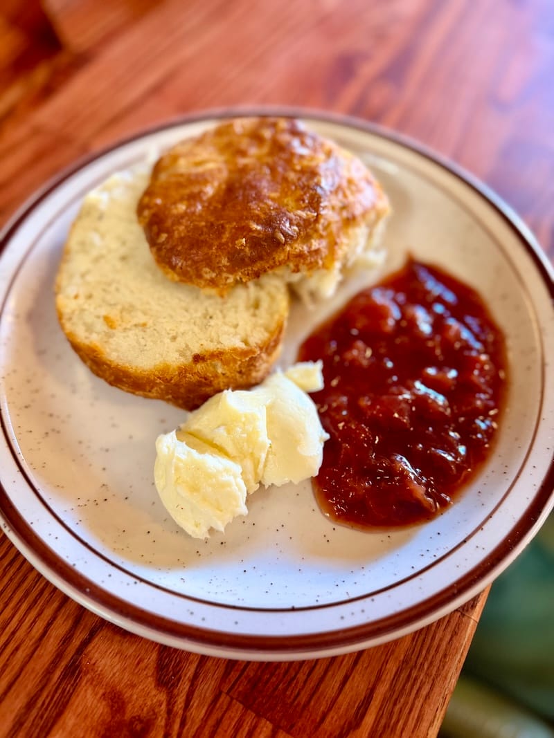 A buttermilk biscuit with butter and plum jam. Photo: © tablehopper.com.