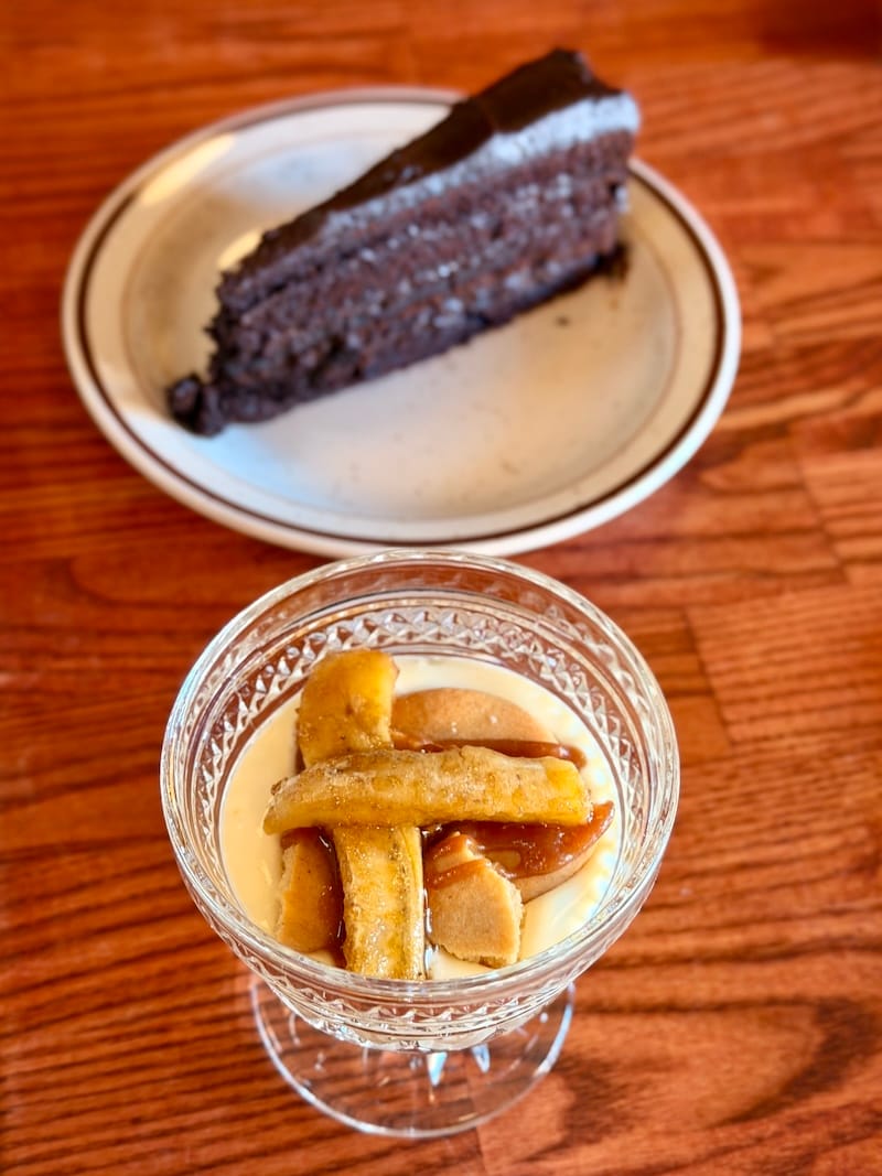 Caramelized banana pudding and the Matilda chocolate cake in the background. Photo: © tablehopper.com.