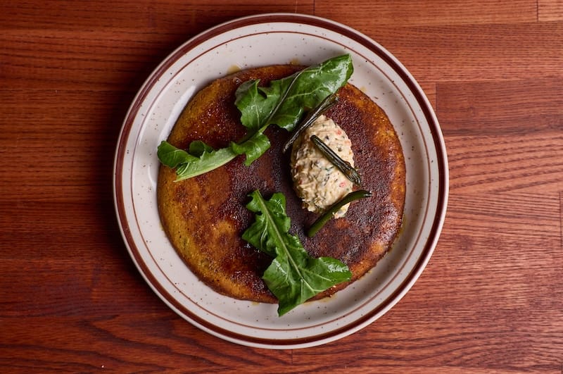The salt cod pancake with pimento cheese. Photo: Molly DeCoudreaux.