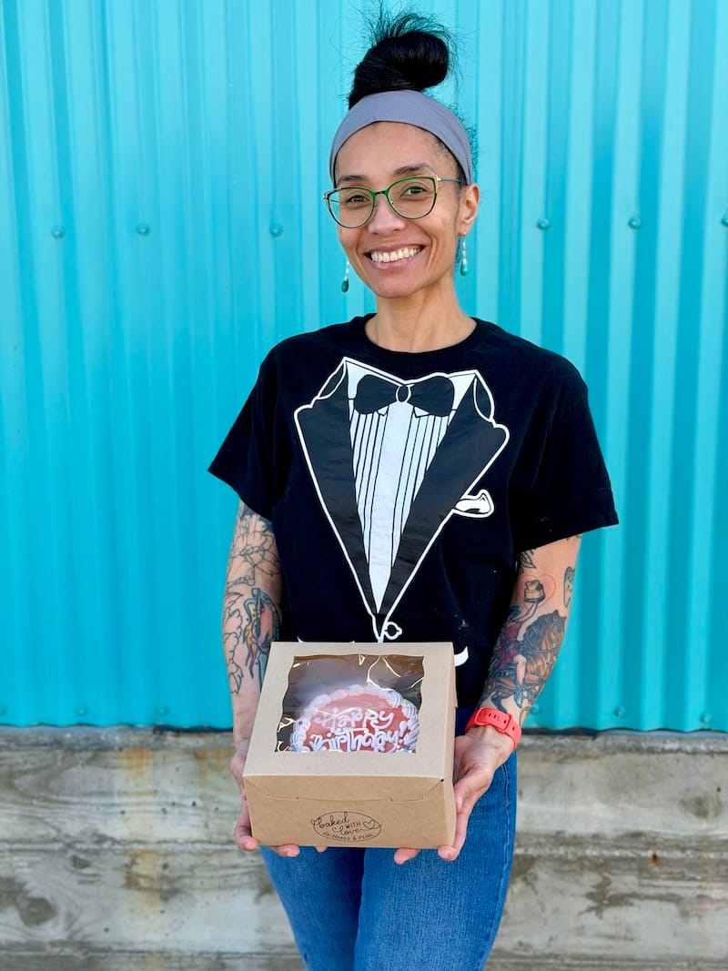Tamara Esparza with my birthday cake in front of Honey & Pearl’s new kitchen space in Emeryville. Photo: © tablehopper.com.