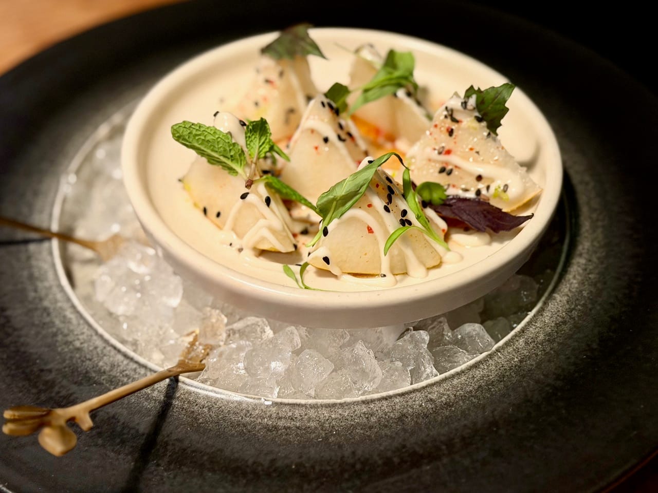Rich Table’s Shinko pear dressed in a tom kha sauce with makrut lime leaf. Photo: © tablehopper.com.