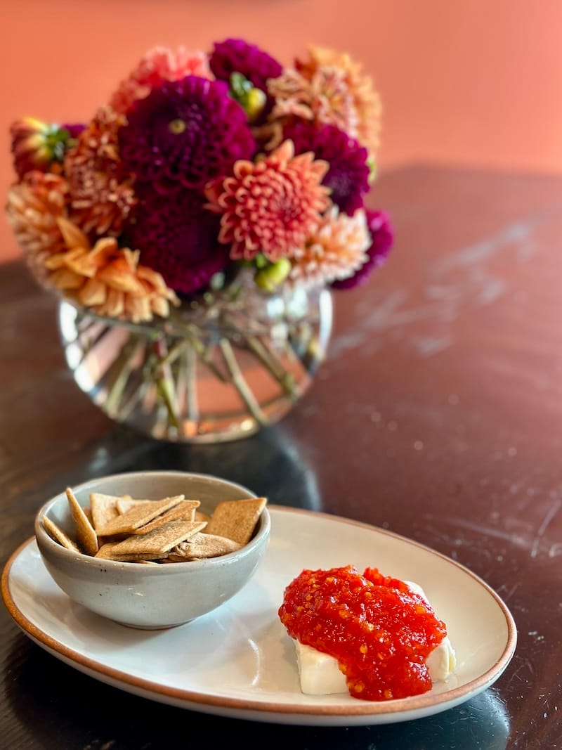 Housemade pepper jelly over cream cheese with wheat thins at The Nosh Box. Photo: © tablehopper.com.
