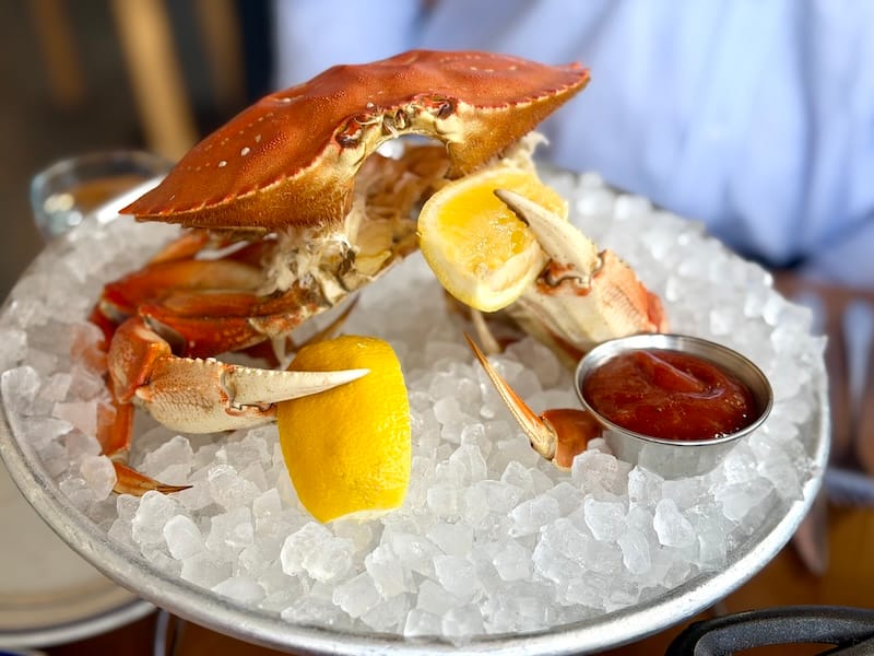 The cheeky presentation of the chilled Dungeness crab at Popi’s Oysterette. Photo: © tablehopper.com.