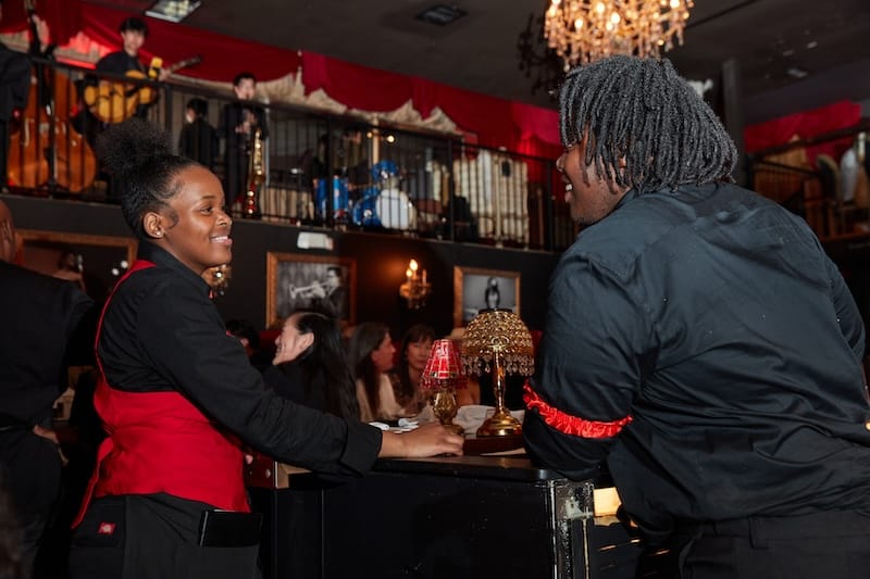 The red-themed room and server attire at Old Skool Cafe are all set for Valentine’s Day. Photo courtesy of Old Skool Cafe.