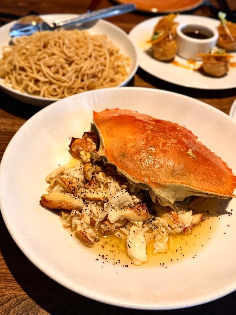 AN’s famous garlic roasted Dungeness crab and garlic noodles at Crustacean. Photo: © tablehopper.com.