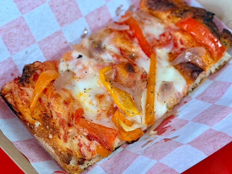 A slice of the ortolana, with roasted peppers and onions. Photo: © tablehopper.com.