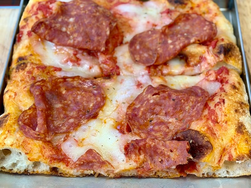 Pizza calabrese in teglia alla romana (before it gets warmed up in the oven). Photo: © tablehopper.com.