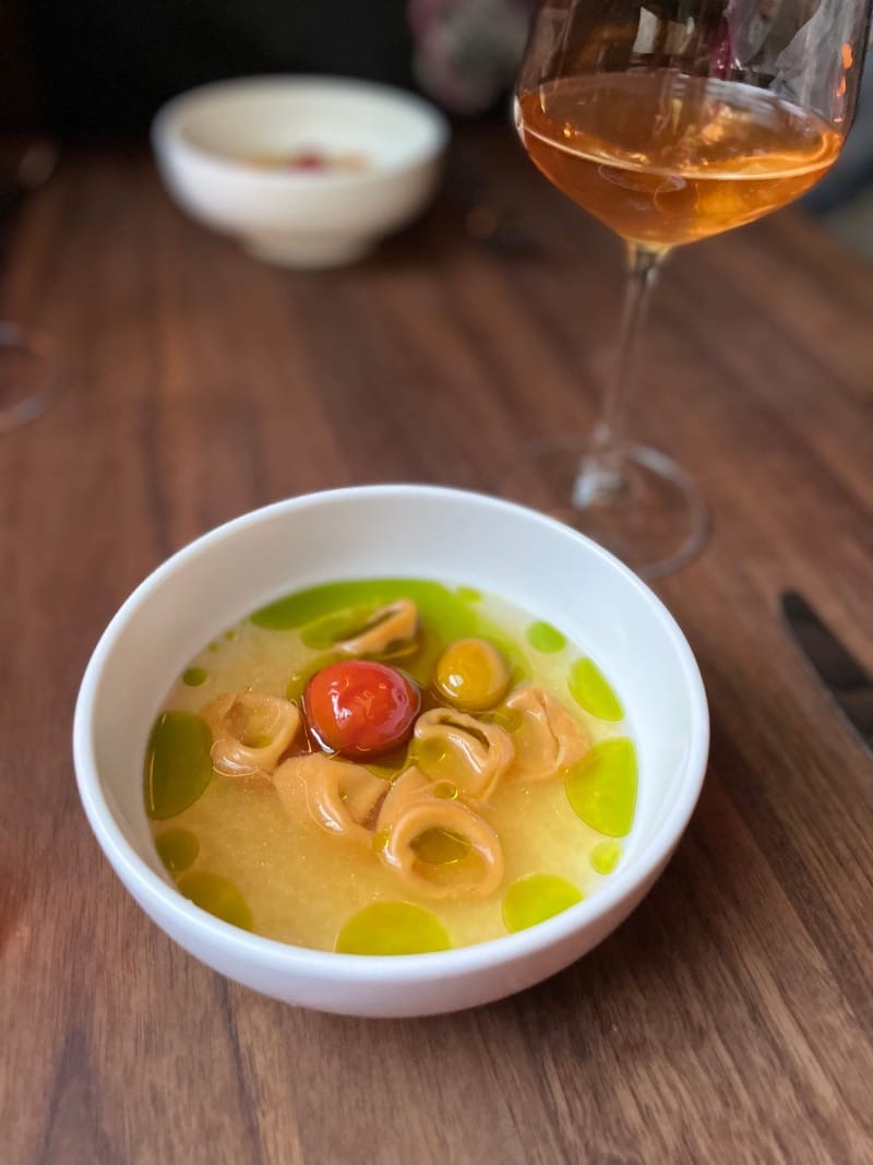 Flour + Water’s tortellini in brodo with eggplant, tomato consommé, and basil oil. Photo: © tablehopper.com.