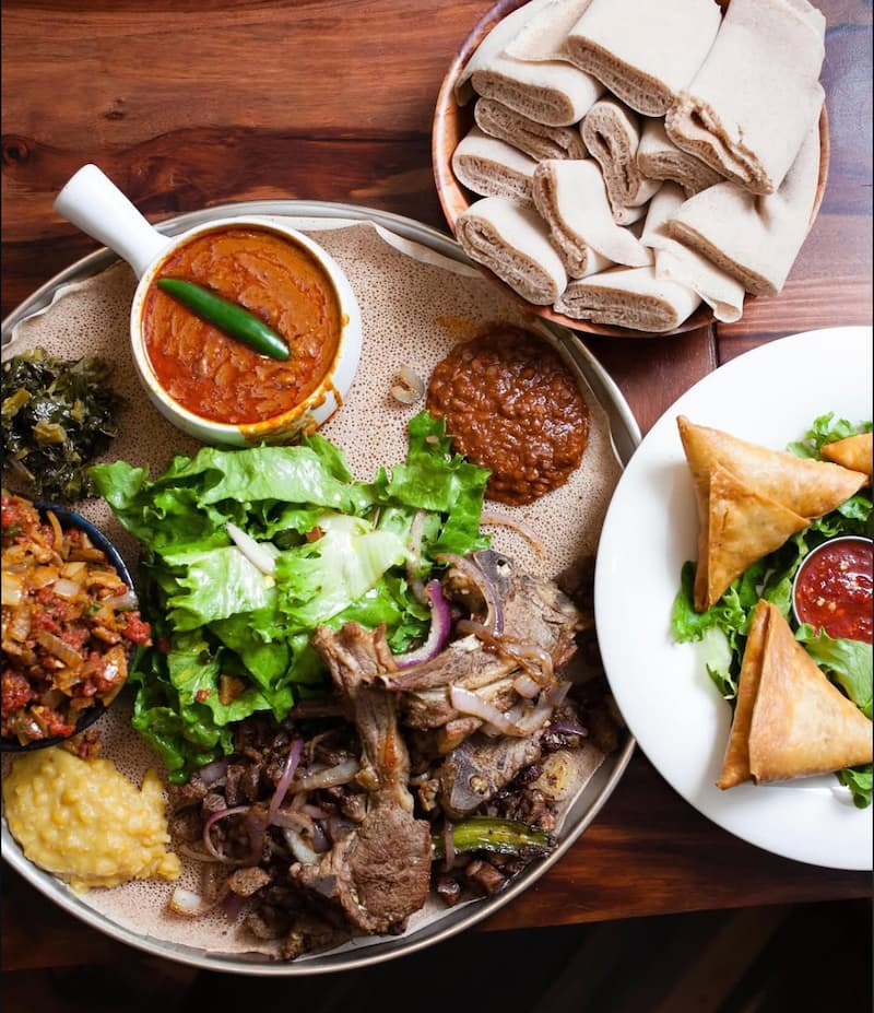 Assortment of Ethiopian meats, curries, and appetizers with injera at Enssaro. Instagram photo via @enssarooakland.