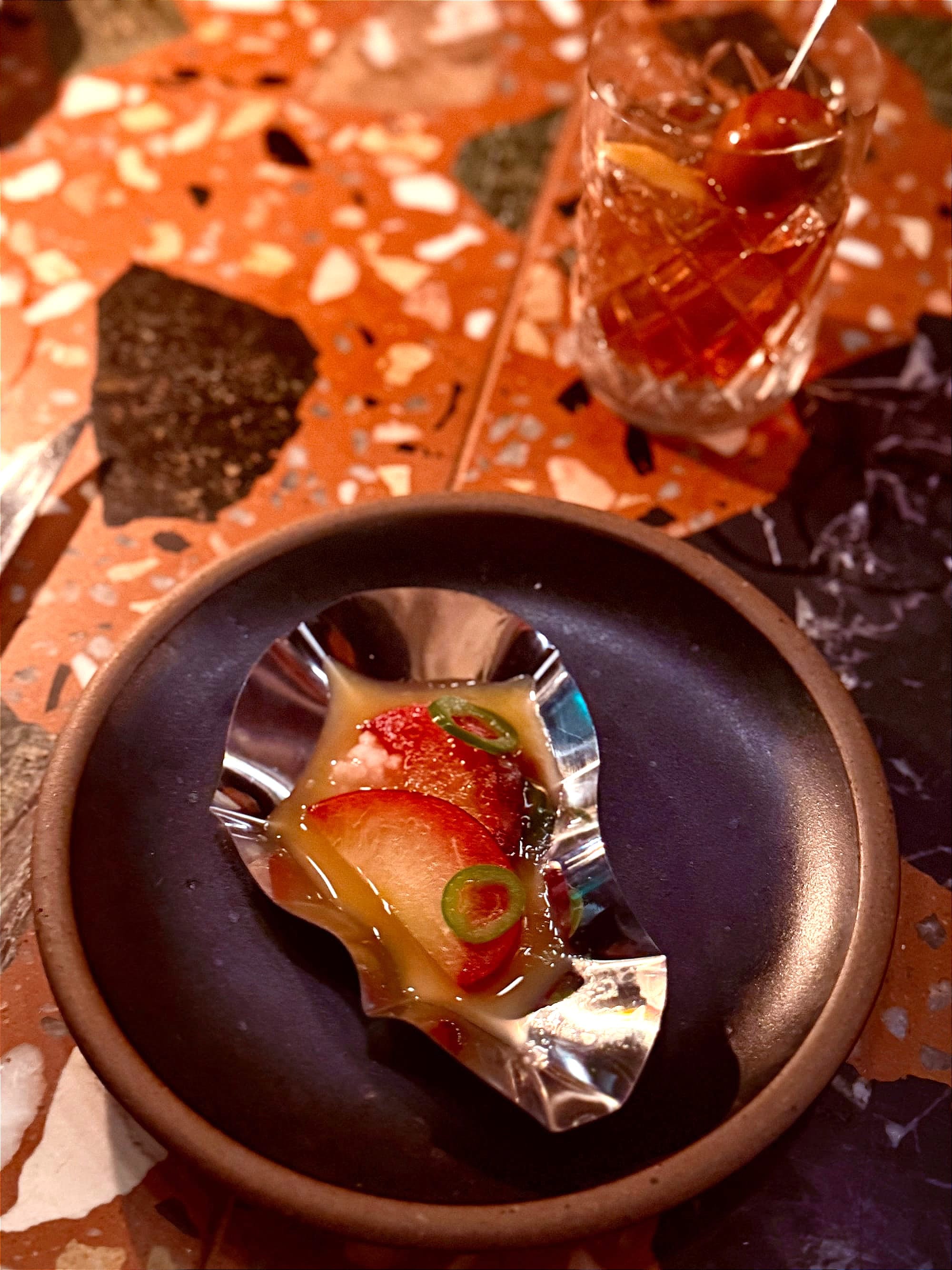 The vegan version of an oyster amuse bouche: pickled plums! Photo: © tablehopper.com.