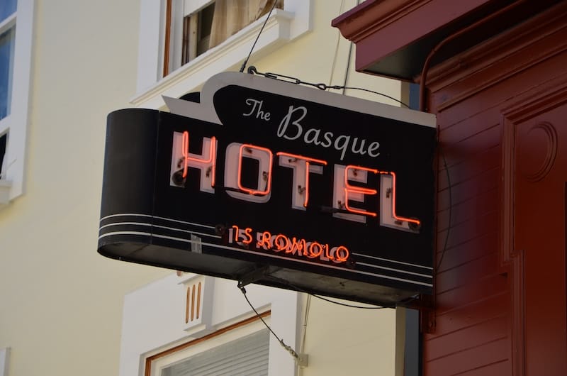 Take a peek up Romolo Place and you can’t miss The Basque Hotel’s glowing neon signage. Photo courtesy of SF Neon.