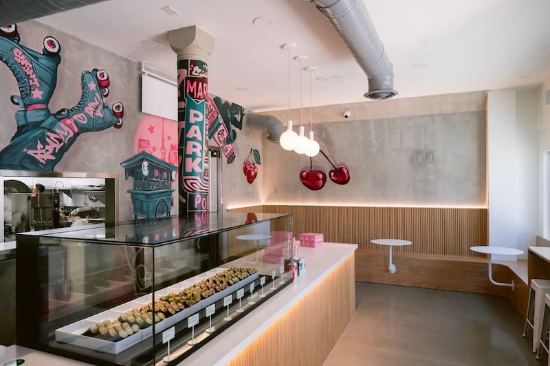 A few of the tables and counter seats inside Handroll Hawker. Photo: Kristen Loken.