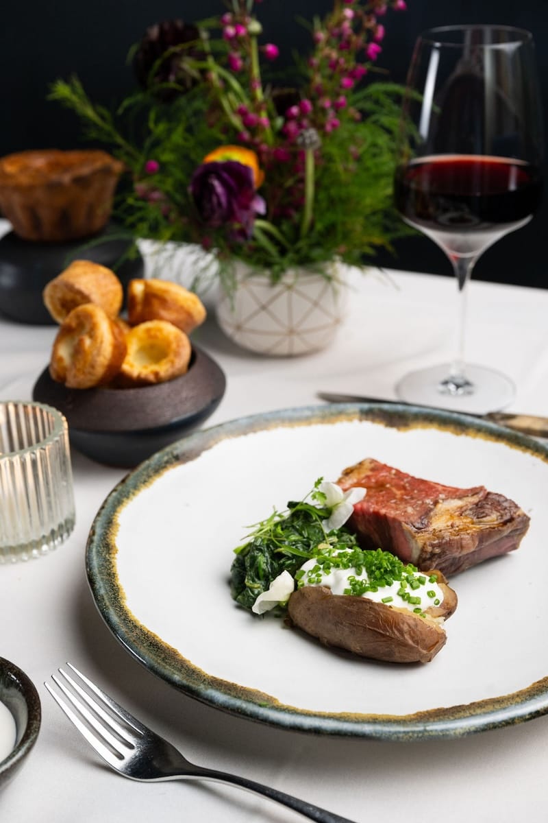 Prime rib, baked potato, creamed spinach...a classic trifecta of culinary happiness. Photo: Adahlia Cole Photography.