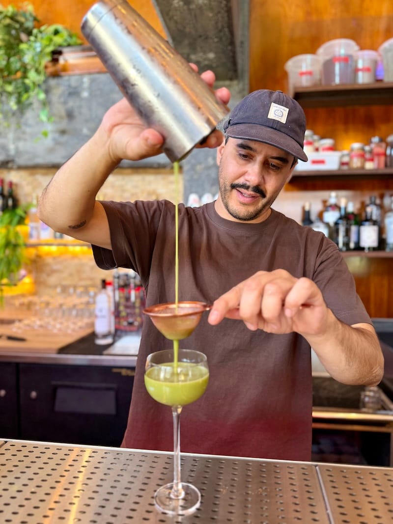 Mohammed “Mo” Zagha straining a Nihon Buzz. Photo: © tablehopper.com.